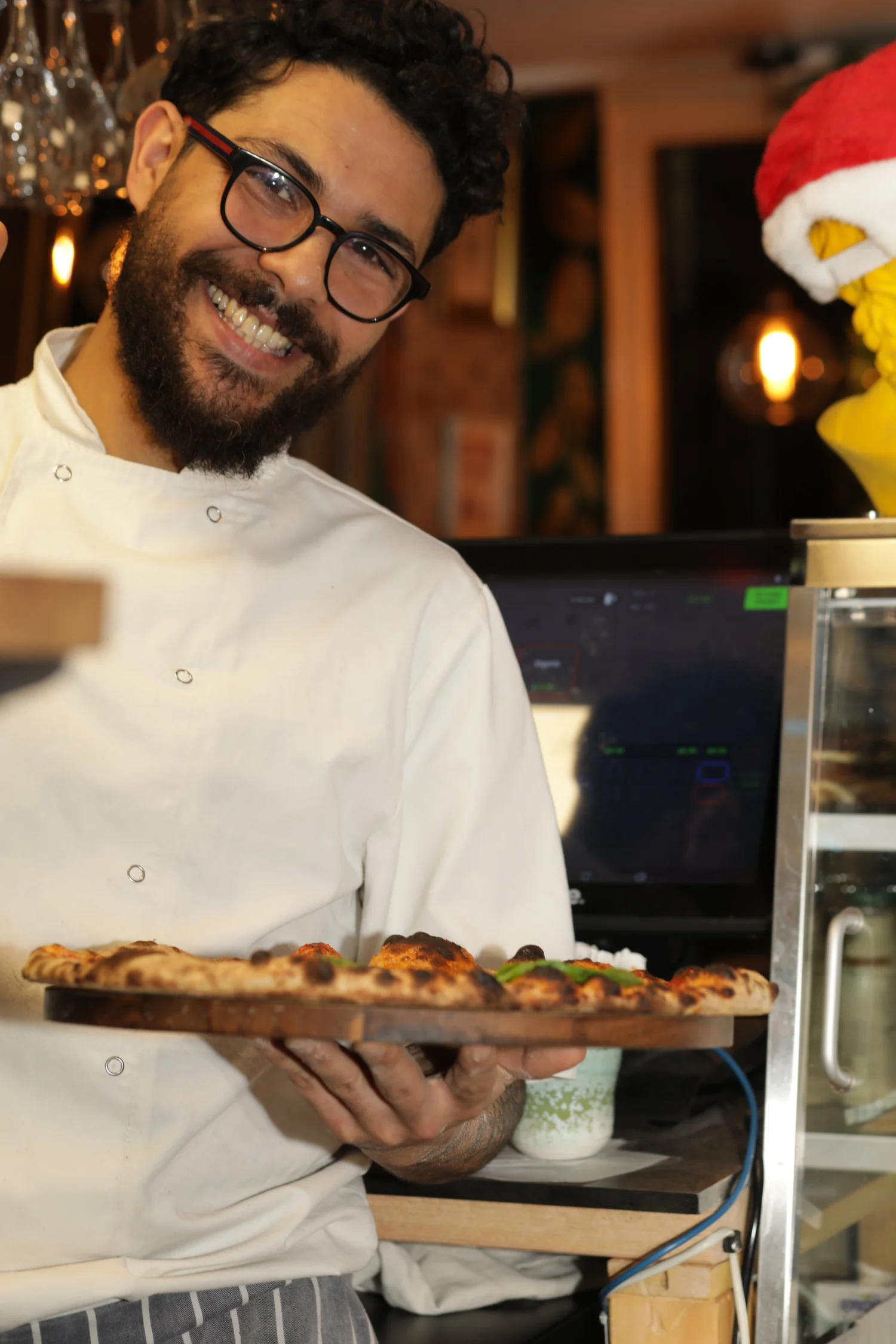 Chef serving pizza